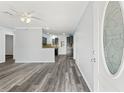 Inviting living room with durable wood-look floors offering an open concept floor plan at 15124 Omaha St, Hudson, FL 34667