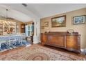 Elegant dining room with hardwood floors, vintage buffet, and natural lighting at 16905 Hawkridge Rd, Lithia, FL 33547
