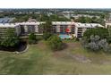 Aerial view showcasing the community buildings and the inviting swimming pool at 1817 Golfview Dr # 1817, Tarpon Springs, FL 34689
