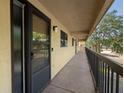 Hallway view with neutral decor and a view of a mature tree canopy at 1817 Golfview Dr # 1817, Tarpon Springs, FL 34689