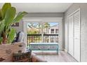 A bright room shows sliding glass doors to a patio, and a closet at 1930 Laughing Gull Ln # 1225, Clearwater, FL 33762
