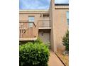 Inviting condominium building with stairs leading to upper-level units and well-maintained landscaping at 225 Country Club Dr # A207, Largo, FL 33771