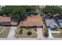 Birds eye view of a ranch style home with a nicely landscaped front yard and surrounding neighborhood at 2505 E 19Th Ave, Tampa, FL 33605