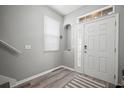 Bright entryway with durable flooring, stylish lighting, and a convenient niche for decor at 3056 Pointeview Dr, Tampa, FL 33611