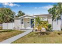 Charming single story home featuring well-maintained landscaping, a walkway, and neutral paint at 3300 Jackson N St, St Petersburg, FL 33704