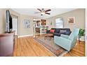 Cozy living room featuring hardwood floors, neutral paint, and an open floor plan at 3300 Jackson N St, St Petersburg, FL 33704