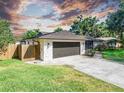 Well-maintained single-story home with a two-car garage, new roof, and beautifully landscaped yard at 3629 Lake Breeze Dr, Land O Lakes, FL 34639