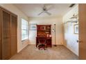 A bright bedroom featuring neutral walls, carpeted floors, and a window with a view at 4442 Summer Oak Dr, Tampa, FL 33618