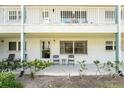 Condo exterior featuring a cozy patio with seating and manicured landscaping at 5216 81St N St # 2, St Petersburg, FL 33709