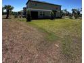 Expansive backyard with a lush green lawn, ideal for outdoor activities and relaxation at 6942 Ripple Pond Loop, Zephyrhills, FL 33541
