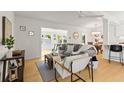 Open-concept living area with natural light, stylish decor, and seamless flow to adjacent spaces at 722 61St S Ave, St Petersburg, FL 33705