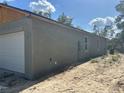 Exterior view of home featuring a two-car garage and newly installed stucco at 8149 Cashew, Webster, FL 33597