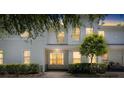 Charming two-story townhouse featuring a well-maintained front yard and a serene, inviting entrance at 9628 Charlesberg Dr, Tampa, FL 33635