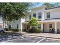 Well-maintained townhouse with assigned parking, landscaping, and a private, covered entryway at 9628 Charlesberg Dr, Tampa, FL 33635