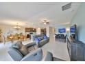 A spacious open-concept layout connecting the living room, dining area, and kitchen with lots of natural light at 15426 Wicked Strong St, Sun City Center, FL 33573