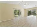 Inviting bedroom boasts plenty of natural light, vaulted ceilings, and access to the outdoor patio at 17812 Arbor Greene Dr, Tampa, FL 33647