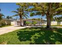 Charming home with lush front lawn and mature trees at 263 87Th N Ave, St Petersburg, FL 33702