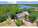 Waterfront home featuring lush landscaping and a private dock for enjoying scenic water views at 2635 Manatee Harbor Dr, Ruskin, FL 33570