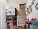Living room featuring a staircase and views of the adjacent living area at 3115 W Wyoming Ave, Tampa, FL 33611