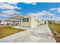 Delightful single-story home with an attached storage shed at 36848 Beth Ave, Zephyrhills, FL 33542