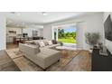 Bright living room with plush sectional sofa, open floor plan, and sliding glass doors to the backyard at 37194 Clinch Cir, Zephyrhills, FL 33540