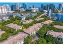 Stunning aerial of the condo community and the downtown city skyline and waterfront in the distance at 728 Seagate Dr, Tampa, FL 33602