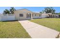 Charming one-story home with a well-manicured lawn and private driveway at 8526 Blue Ridge Dr, Tampa, FL 33619