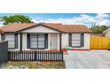 Inviting single-Gathering home with a fresh concrete driveway and well-manicured front yard at 9201 Spy Glass Ct, Tampa, FL 33615