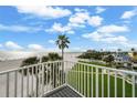 Breathtaking ocean views from the balcony, with palm trees and beach at 17960 Gulf Blvd # 225, Redington Shores, FL 33708