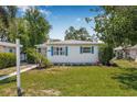 Well maintained single-story home with blue shutters and a well-kept lawn at 2134 6Th N Ave, St Petersburg, FL 33713