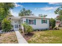 Single-story home featuring a welcoming front porch and tidy front lawn at 2134 6Th N Ave, St Petersburg, FL 33713
