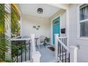 Cozy front porch area with seating and a charming turquoise front door at 2134 6Th N Ave, St Petersburg, FL 33713