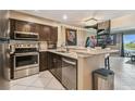 Well-equipped kitchen featuring stainless steel appliances and stylish granite countertops at 2400 Feather Sound Dr # 735, Clearwater, FL 33762