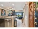 Bright and spacious living space with granite countertops and stainless steel appliances at 2400 Feather Sound Dr # 735, Clearwater, FL 33762