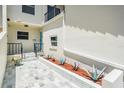 Charming front entrance with tiled walkway and vibrant succulent plants, offering a welcoming approach at 2700 Bayshore Blvd # 511, Dunedin, FL 34698