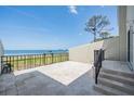 Private patio with wrought iron railing, offering stunning water views and outdoor relaxation space at 2700 Bayshore Blvd # 511, Dunedin, FL 34698