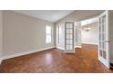 Bright living room with wood floors, natural light, and French doors at 3439 Northridge Dr, Clearwater, FL 33761