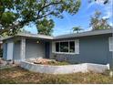 Charming home featuring a well-manicured yard and unique architectural details at 3487 Keene Park Dr, Largo, FL 33771