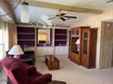 Cozy living room with built-in shelving and a comfortable seating area at 35804 Brisa Dr, Zephyrhills, FL 33541