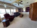 Comfortable living room with lots of natural light and well-kept carpets at 35804 Brisa Dr, Zephyrhills, FL 33541