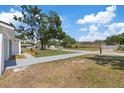 Long driveway leading to a well-maintained home in a quiet residential neighborhood at 3622 Tamarix Dr, Tampa, FL 33619