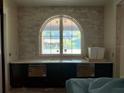 Kitchen area with an arched window and custom cabinetry at 4224 W Corona St, Tampa, FL 33629
