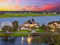 Waterfront home next to a golf course with beautiful landscaping at 429 St Andrews Dr, Belleair, FL 33756