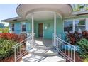 Close-up of the charming front porch, showcasing the unique architectural details and inviting entrance at 5051 5Th S Ave, St Petersburg, FL 33707