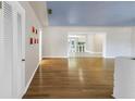 Spacious living room with beautiful hardwood floors, natural light, and open layout at 5051 5Th S Ave, St Petersburg, FL 33707
