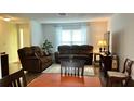 This living room is perfect for entertaining, with great lighting, cozy seating, and a warm and inviting atmosphere at 10627 Mira Vista Dr, Port Richey, FL 34668
