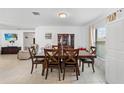 Bright dining room with a wooden table, six chairs, and neutral decor at 1102 Wynnmere Walk Ave, Ruskin, FL 33570