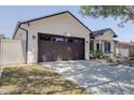 Single-story home with spacious driveway and well-manicured lawn at 1150 7Th Ne Ave, Largo, FL 33770