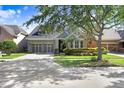 Charming one-story home featuring a two car garage, manicured landscaping, and a well-maintained lawn at 11644 Meridian Point Dr, Tampa, FL 33626