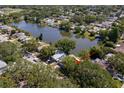 An aerial view showing the home's proximity to the beautiful lake at 1393 Chesterfield Dr, Dunedin, FL 34698